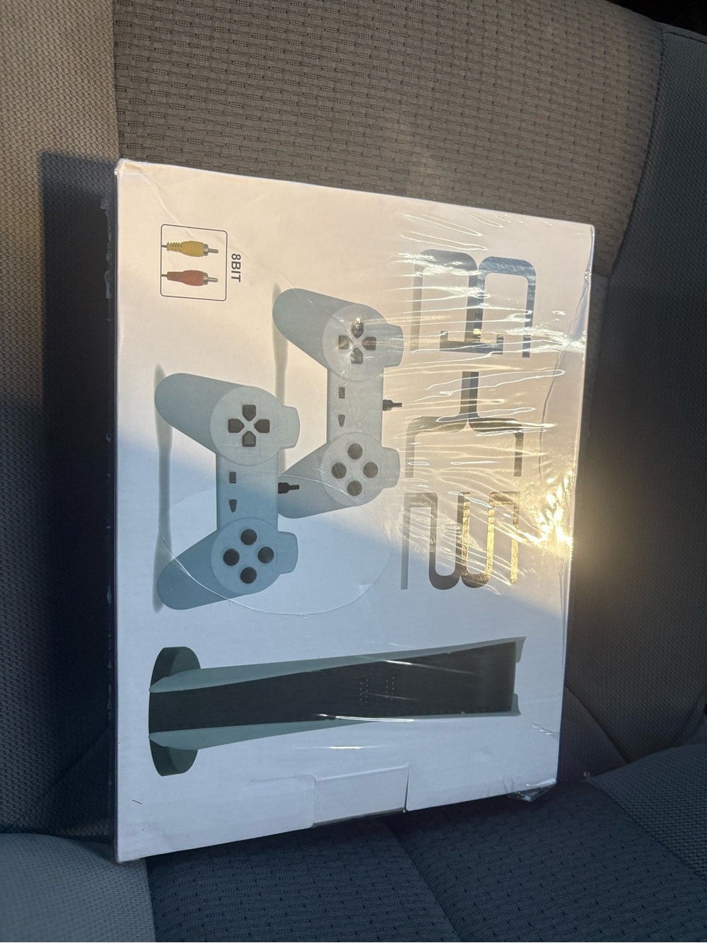 Retro Style Game Console with Two Pale Blue Controllers